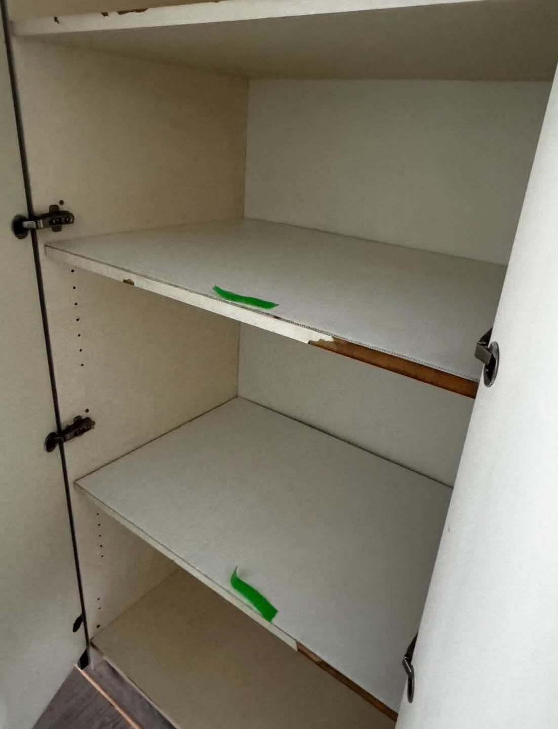 Damaged cabinet shelf edge before repair