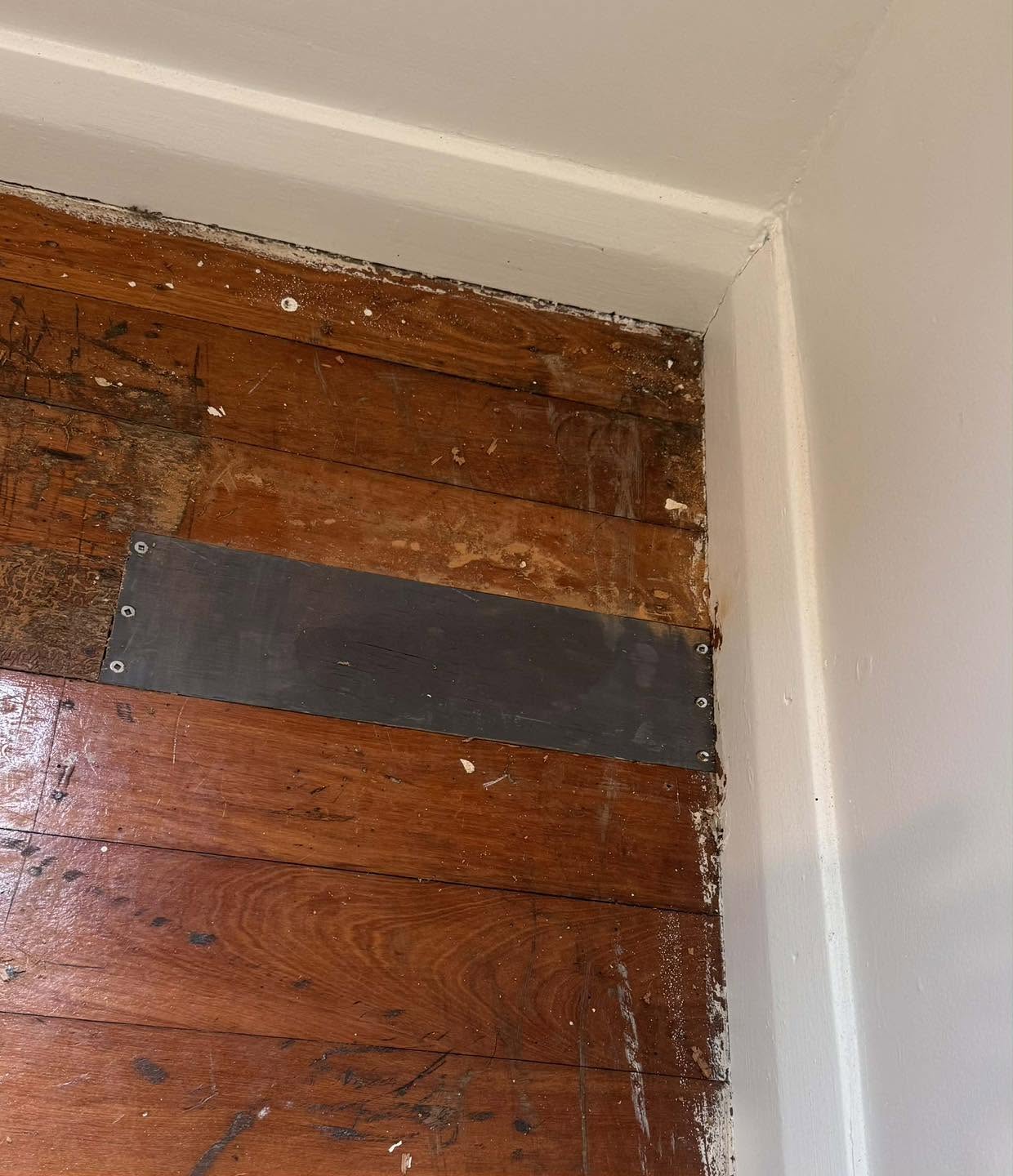 Floor repair at a student flat before carpet installation