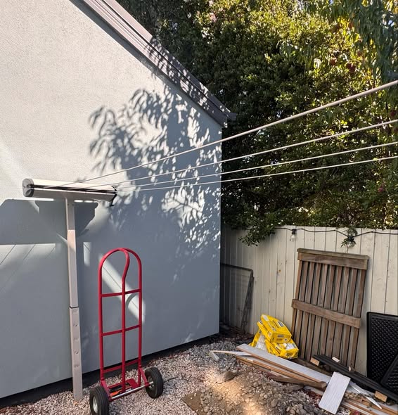 Fold-down clothesline installed in a garage