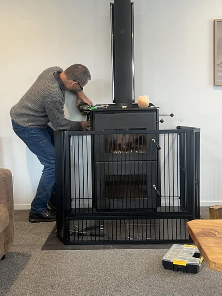 Steve working on a fireplace safety enclosure in Christchurch