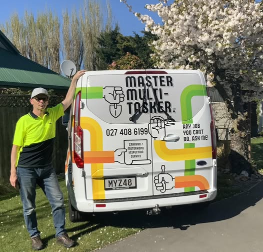 Steve of Master Multi-Tasker standing beside his branded work van in Christchurch